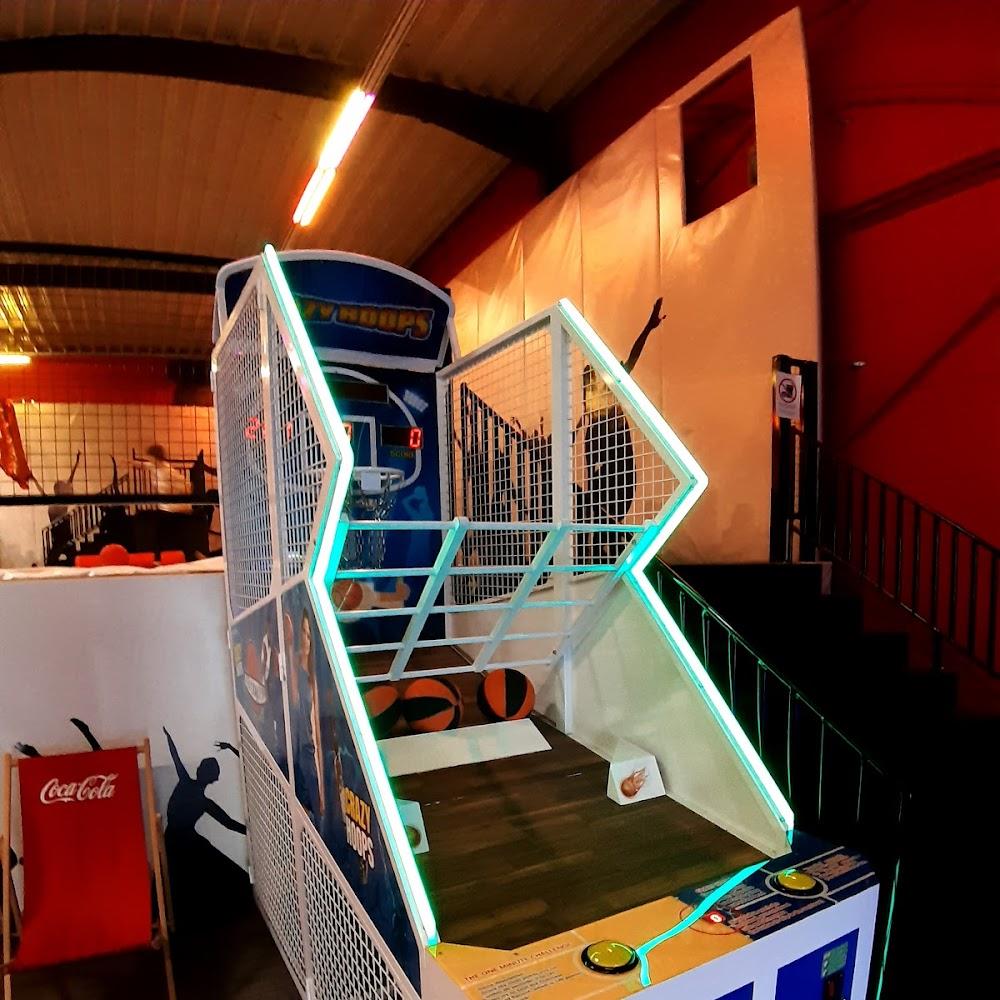 Basketball arcade game with glowing green trim.